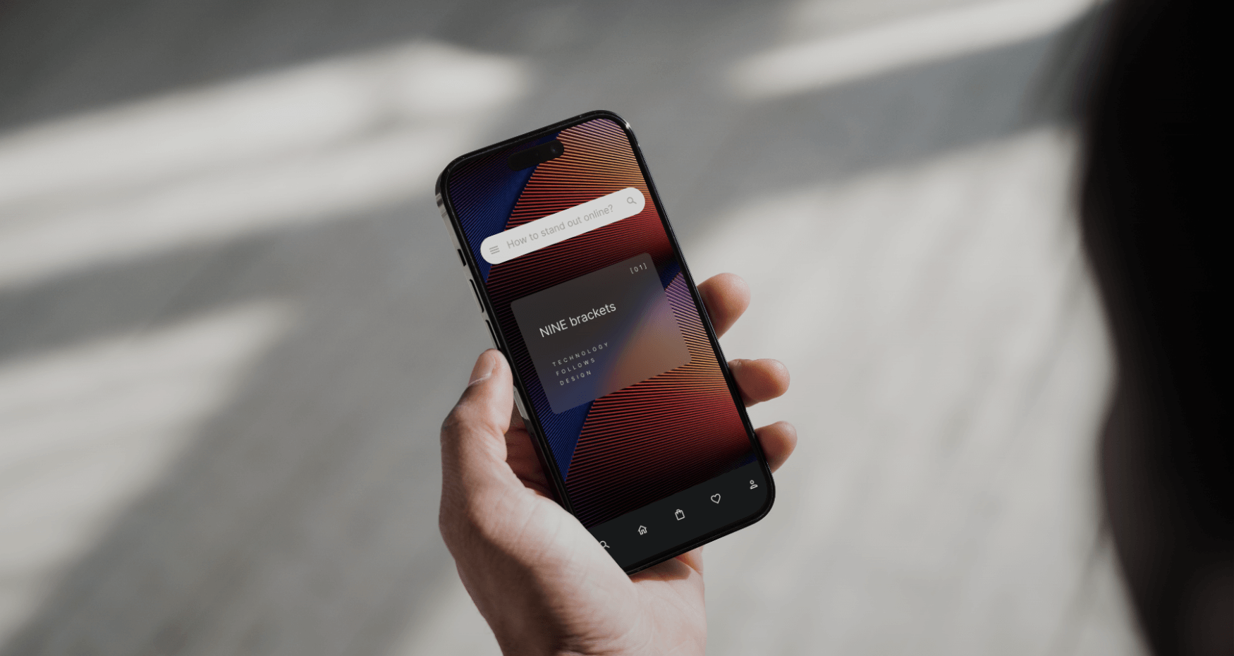 Eine Person hält ein Smartphone in der Hand, auf dem eine Musik-App mit dem Song NME in Klammern angezeigt wird; in der Suchleiste oben steht How to embed audio code... - die perfekte Inspiration für eine b2b-Agentur, die eine Unternehmenswebsite mit ki und automatisierung gestaltet. - NINE brackets Digitalagentur München