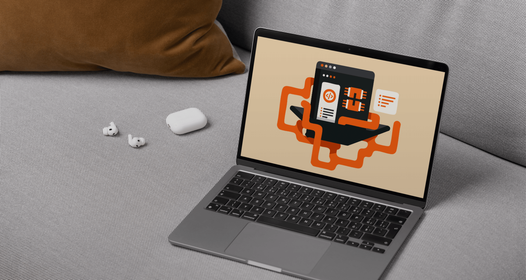 Ein Laptop auf einer grauen Couch zeigt Programmiergrafiken, daneben liegen kabellose Ohrhörer und ein braunes Kissen - die perfekte Inspiration für eine digitalagentur München, die eine Unternehmenswebsite oder ein B2B-Agenturprojekt entwirft. - NINE brackets Digitalagentur München